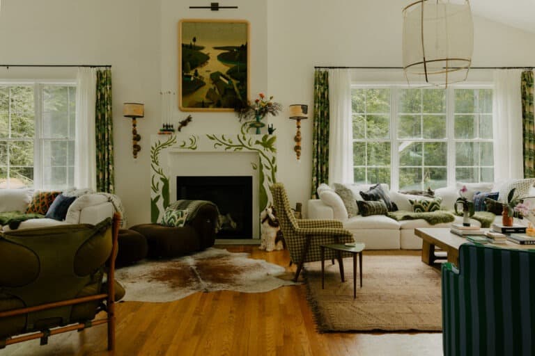 Medford OR living room remodel featuring refinished white oak hardwood floors, custom hand-plastered fireplace surround with botanical stencil detail, new window trim, and ENERGY STAR windows
