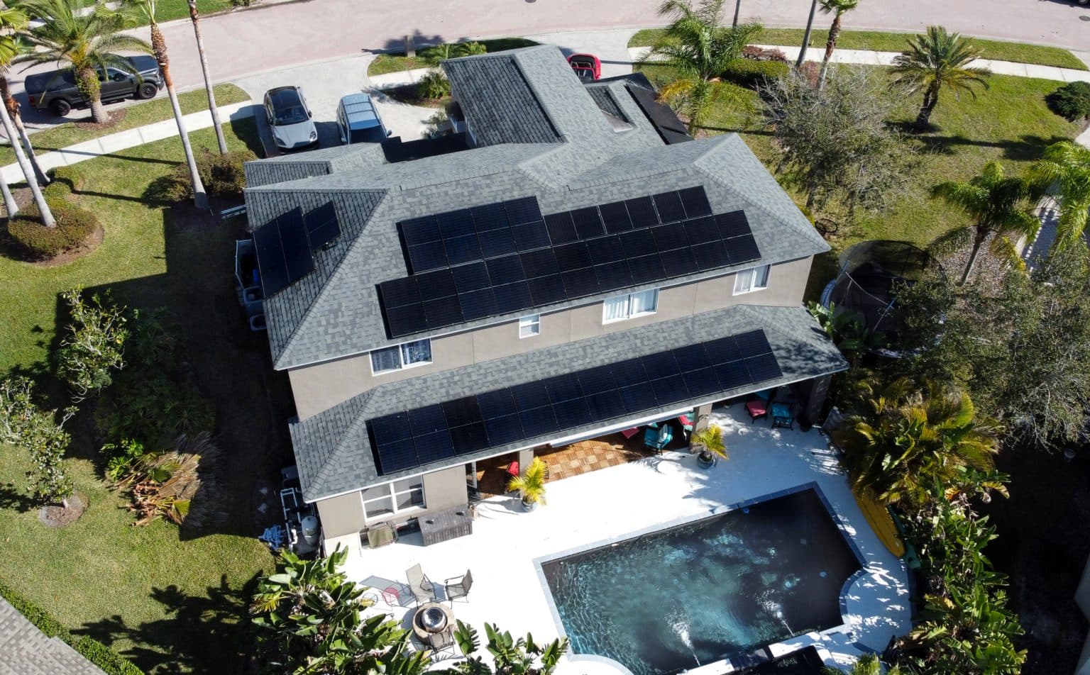 Aerial view of a residential rooftop solar panel installation by HomeJobDone